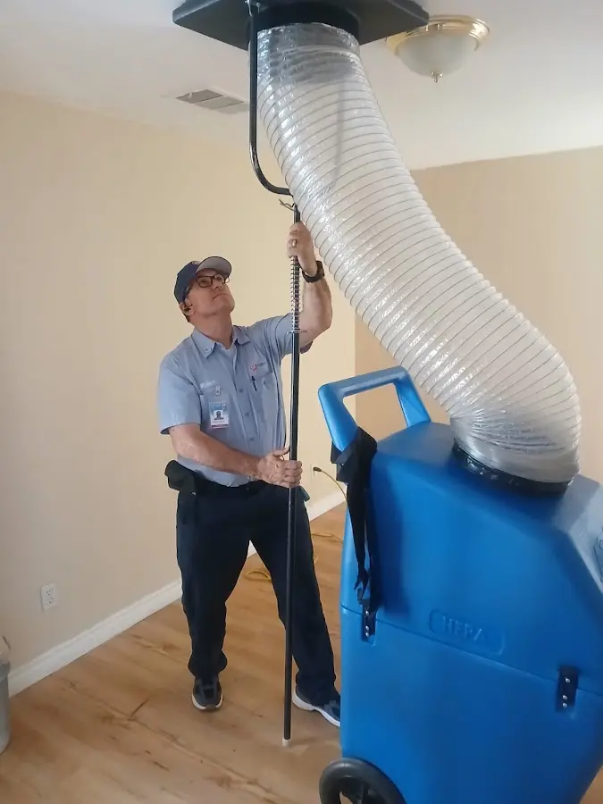 Furnace Tune-Up technician using HEPA equipment in La Puente